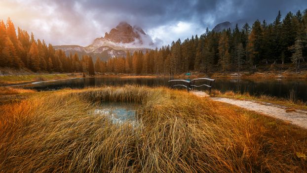 Autumn view with red foliage of Alps with lake in Tyrol