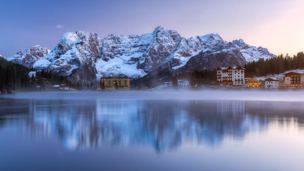 Misurina Lake, on Dolomites (Italian Alps) seen at sunrise. Sorapiss mountain in the background. South Tyrol, Dolomites, Italy.