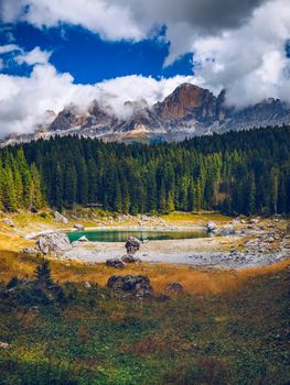 Autumn view with red foliage of Alps with lake in Tyrol