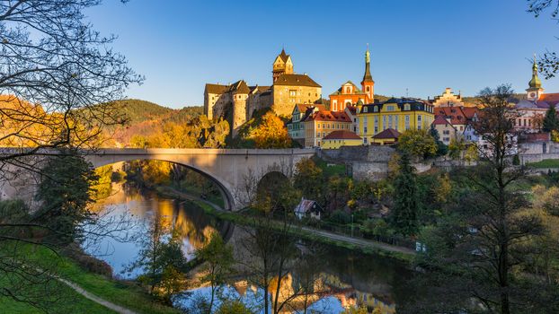 Colorful town Loket in autumn over Eger river in the Sokolov District in the Karlovy Vary region of the Czech Republic