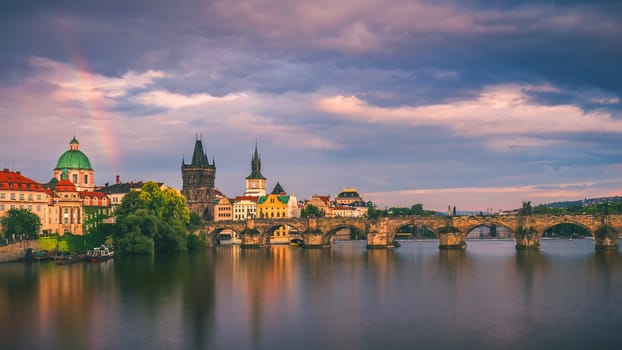 Scenic spring sunset aerial view of the Old Town pier architecture and Charles Bridge over Vltava river in Prague, Czech Republic