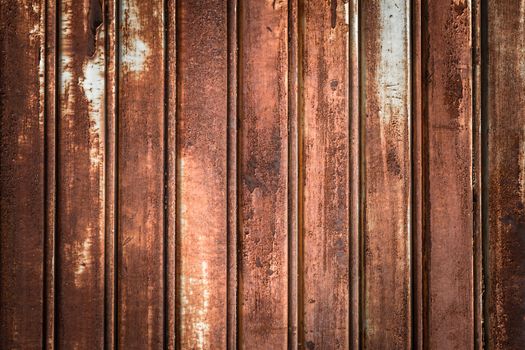 Front view of a shutter rusted, deteriorated from elements.