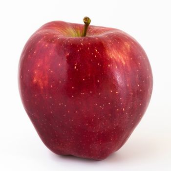 Close-up of a red apple on white background and copy space.