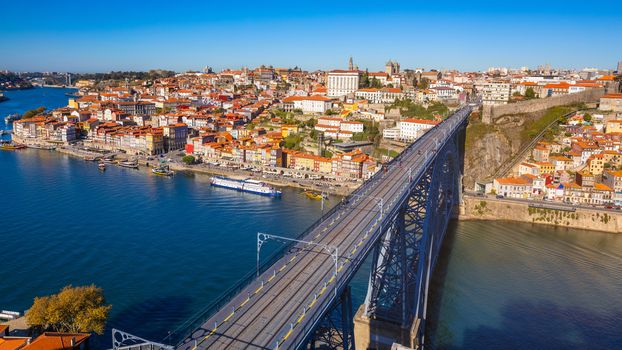 Panoramic view of Old city of Porto (Oporto) and Ribeira over Douro river, Portugal. Concept of world travel, sightseeing and tourism.