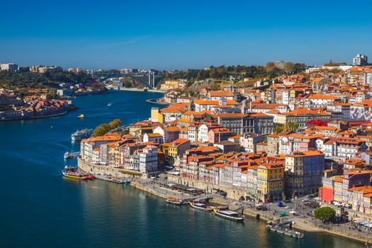 Panoramic view of Old city of Porto (Oporto) and Ribeira over Douro river, Portugal. Concept of world travel, sightseeing and tourism.