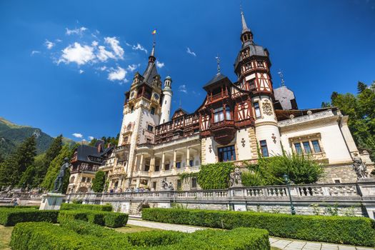 Peles Castle, Romania. Beautiful famous royal castle and ornamental garden in Sinaia landmark of Carpathian Mountains in Europe