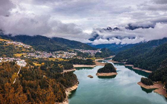 Autumn view with red foliage of Alps with lake in Tyrol