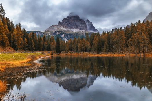 Autumn view with red foliage of Alps with lake in Tyrol