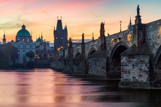 Famous iconic image of Charles bridge, Prague, Czech Republic. Concept of world travel, sightseeing and tourism.