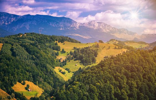 Summer alpine Transylvania landmark, landscape with green fields and valleys, high Piatra Craiului mountains, Carpathians, Transylvania, Romania, Europe