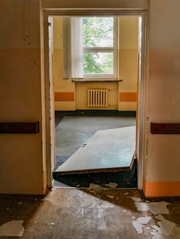 Forced doors of old abandoned hospital room