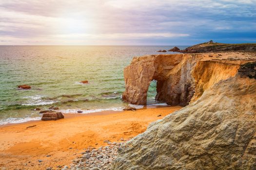 Spectacular natural cliffs and stone arch Arche de Port Blanc and beautiful famous coastline, Brittany (Bretagne), France, Europe