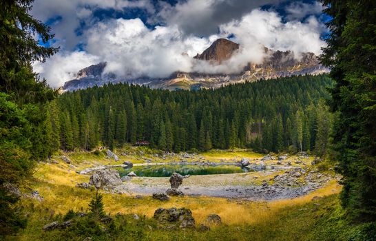 Carezza lake (Lago di Carezza, Karersee) with Mount Latemar, Bolzano province, South tyrol, Italy.
