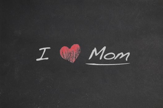 Blackboard with phrase, I love mom.