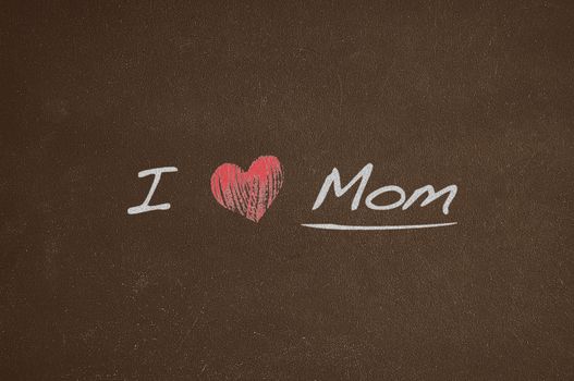 Blackboard with phrase, I love mom.