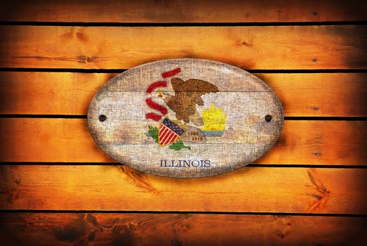 A Illinois flag on brown wooden planks.