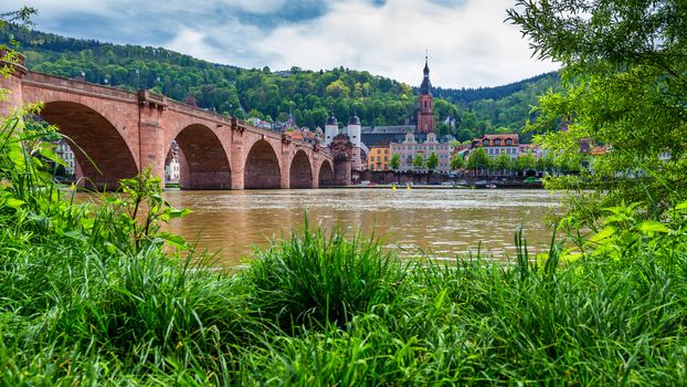 Panoramic view of beautiful medieval town Heidelberg including Carl Theodor Old Bridge, Neckar river, Church of the Holy Spirit, Germany