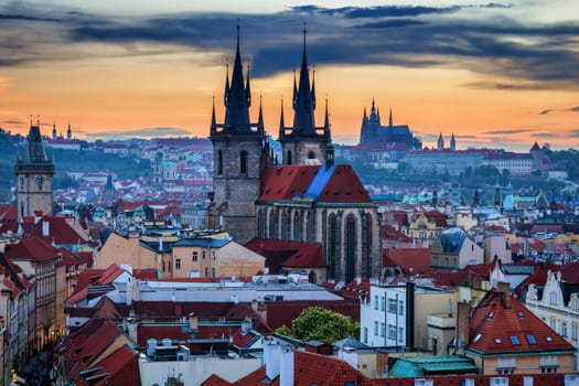 Aerial view over Church of Our Lady before Tyn, Old Town and Prague Castle at sunset in Prague, Czech Republic