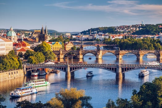 View of the Vltava River and the bridges shined with the sunset sun, Prague, the Czech Republic