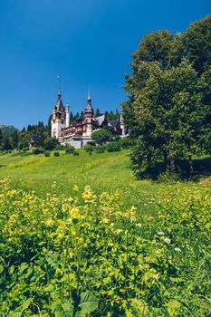 Peles Castle, Romania. Beautiful famous royal castle and ornamental garden in Sinaia landmark of Carpathian Mountains in Europe