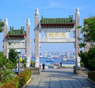 KAOHSIUNG, TAIWAN -- APRIL 29, 2017: The Kaohsiung Martyrs' Shrine is dedicated to the soldiers who died during World War Two. Pictured here is the entrance arch overlooking Kaohsiung Port.
