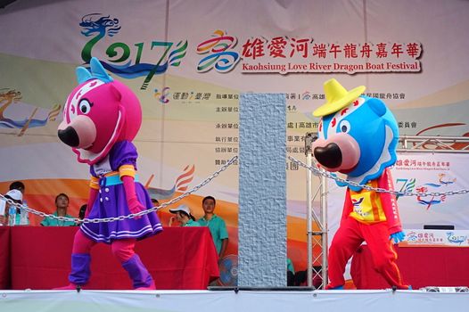 KAOHSIUNG, TAIWAN -- MAY 30, 2017: Dancers dressed up as mascots perform Chinese folk songs at the Dragon Boat Festival.