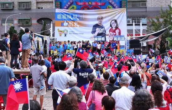 KAOHSIUNG, TAIWAN -- NOVEMBER 10, 2018: Supporters wave national flags at an election rally for KMT Kaohsiung mayor candidate Han Guo-Yun and city council member Huang Hsiang-Shu
