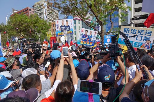 KAOHSIUNG, TAIWAN -- NOVEMBER 11, 2018: Supporters and media rush to greet KMT Kaohsiung mayor candidate Han Guo-Yun at an election event.
