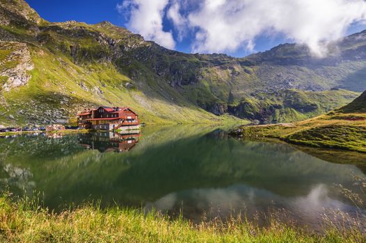 Balea glacier lake near the Transfagarasan road, panoramic view. Balea Lake, is a glacier lake situated at 2034m of altitude in the Fagaras Mountains, in central Romania, Sibiu County. 