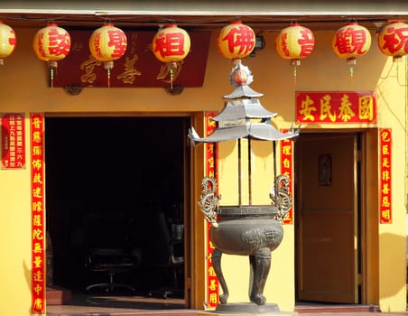 KAOHSIUNG, TAIWAN -- JANUARY 30, 2014: The small Miao-San Temple in Kaohsiung is decorated with colorful lanterns for the Chinese New Year.