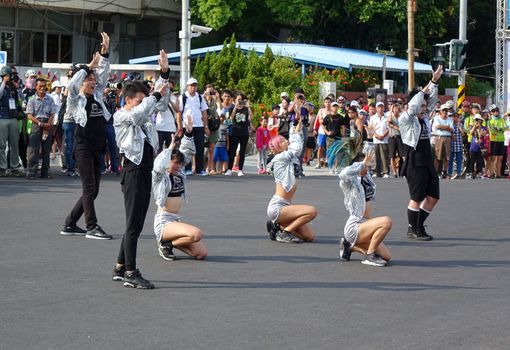 KAOHSIUNG, TAIWAN -- OCTOBER 1, 2017: Young people perform a modern dance at the opening of the 2017 Ecomobility Festival. 