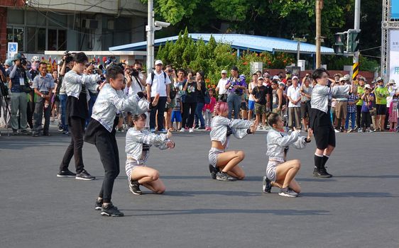 KAOHSIUNG, TAIWAN -- OCTOBER 1, 2017: Young people perform a modern dance at the opening of the 2017 Ecomobility Festival.