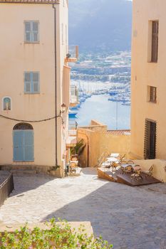 An alley in the citadel and a view of the Marina, in Calvi, The Balagne, Corsica, France