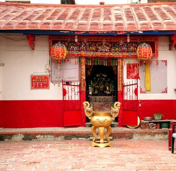 KAOHSIUNG, TAIWAN -- OCTOBER 17, 2015: The small Nan-Tian temple is housed in a traditional Chinese building in a local neighborhood of the Zuoying District.