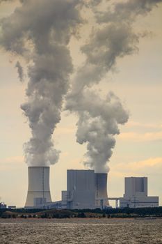 Multiple Coal Fossil Fuel Power Plant Smokestacks Emit Carbon Dioxide Pollution