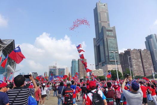 KAOHSIUNG, TAIWAN -- OCTOBER 10, 2019: An excited crowd waves national flags during the national day celebrations at a free, public event.