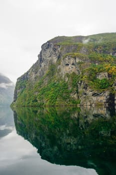 Reflection and View in the Geiranger fjord, Norway