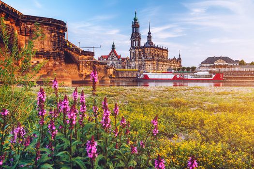 Augustus Bridge (Augustusbrucke) and Cathedral of the Holy Trinity (Hofkirche) over the River Elbe in Dresden, Germany, Saxony.