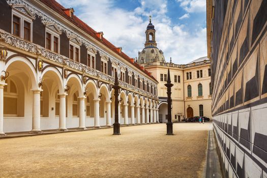 View of Stables Courtyard (Stallhof) toward Chancellery Building, George Gate and Hausmannsturm tower of Dresden Castle, Saxony, Germany.