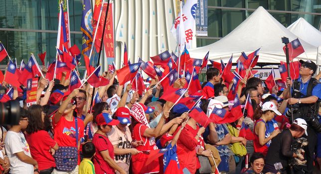 KAOHSIUNG, TAIWAN -- OCTOBER 10, 2019: An excited crowd waves national flags during the national day celebrations at a free, public event.