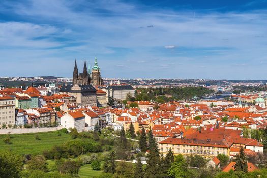 Skyline aerial view of Prague old town, Charles bridge, Prague Castle and St Vitus Cathedral and red roofs. Prague, Czech republic.