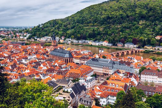 Panoramic view of beautiful medieval town Heidelberg including Carl Theodor Old Bridge, Neckar river, Church of the Holy Spirit, Germany