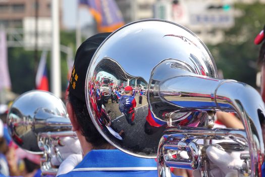 KAOHSIUNG, TAIWAN -- OCTOBER 10, 2019: A marching band dressed in national flag colors takes part in the national day celebrations at a free, public event. 
