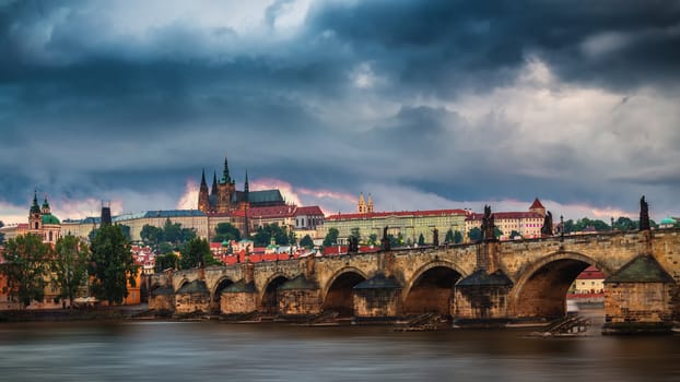 Charles Bridge (Karluv Most) and Lesser Town Tower, Prague in summer at sunset, Czech Republic