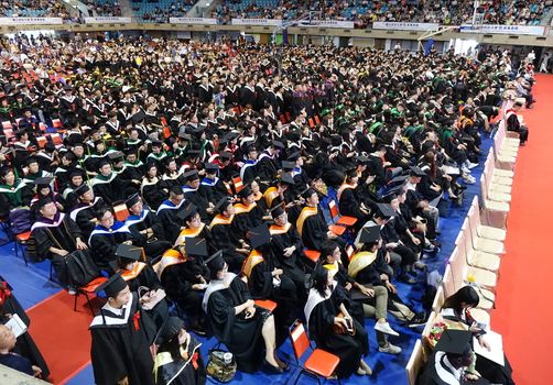 TAINAN, TAIWAN -- JUNE 2, 2018: Graduates listen to a speech at the annual graduation ceremony of NCKU university.