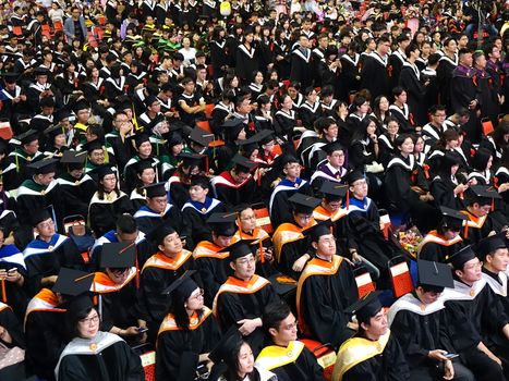 TAINAN, TAIWAN -- JUNE 2, 2018: Graduates listen to a speech at the annual graduation ceremony of NCKU university.
