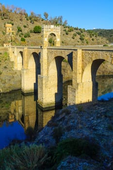 View of the Alcantara Bridge, a Roman stone arch bridge built over the Tagus River, in Extremadura, Spain