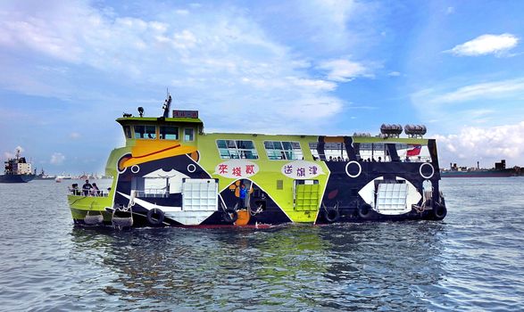 KAOHSIUNG, TAIWAN -- JUNE 30, 2018: This new cross-harbor ferry is powered by electricity and features the popular black bear mascot.
