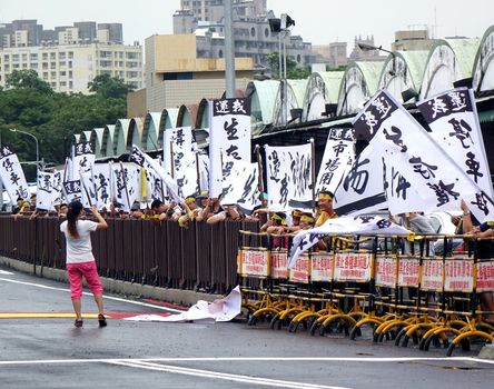 KAOHSIUNG, TAIWAN -- JULY 31 , 2017: Protesters demonstrate at the opening of a controversial new road. The construction had led to forced evictions of residents.
