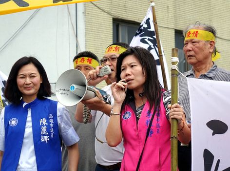 KAOHSIUNG, TAIWAN -- JULY 31 , 2017: Politicians of the opposition Kuomintang join protesters at the opening of a controversial new road. 